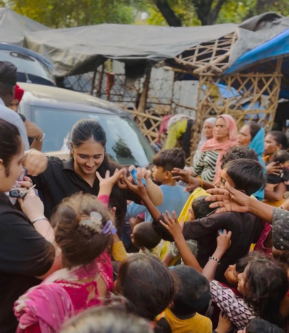 Sikh Youth Association volunteers distributing to children during a seva drive